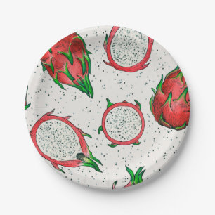 Red dragon fruit on off white paper plate
