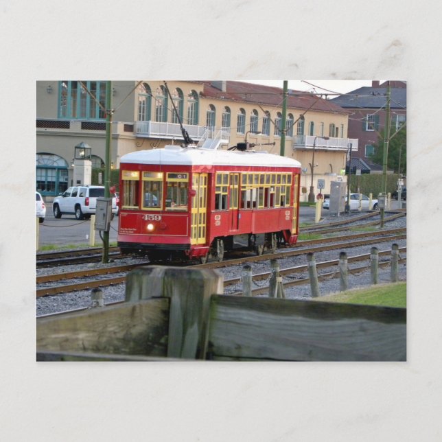 Red electric streetcar on tracks postcard (Front)