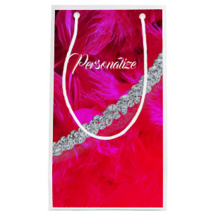 Red feather boa draped with diamonds gift bag