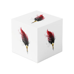 Red feather pen with gold nib cube