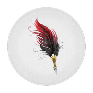 Red feather pen with gold nib cutting board