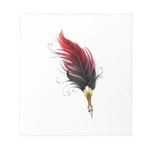 Red feather pen with gold nib notepad