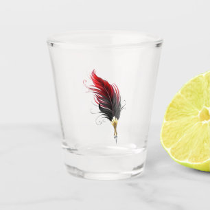 Red feather pen with gold nib shot glass
