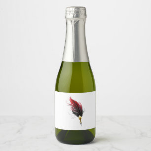 Red feather pen with gold nib sparkling wine label