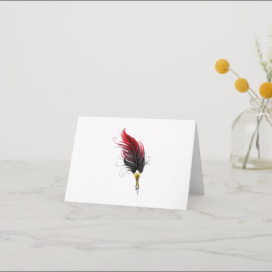 Red feather pen with gold nib thank you card