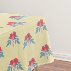 Red flowers and green leaves on brown  tablecloth