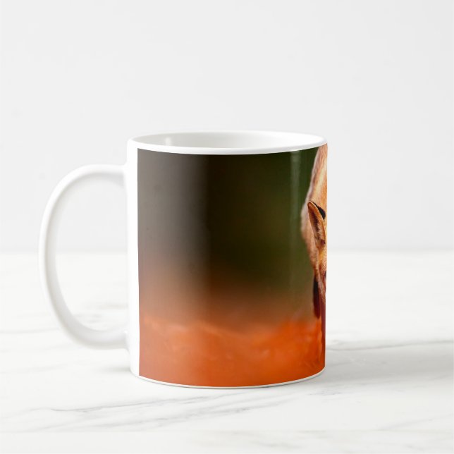 Red fox running on orange autumn leaves. Cute Red  Coffee Mug (Left)