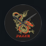 Red Gold Black Fantasy Chinese Dragon Round Clock<br><div class="desc">A fierce black Chinese dragon outlined in gold decorates this wall clock. Red accents highlight the dragon's jaw,  head and spine. Your name is written in bold gold below.</div>