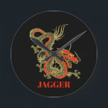 Red Gold Black Fantasy Chinese Dragon Round Clock<br><div class="desc">A fierce black Chinese dragon outlined in gold decorates this wall clock. Red accents highlight the dragon's jaw,  head and spine. Your name is written in bold gold below.</div>