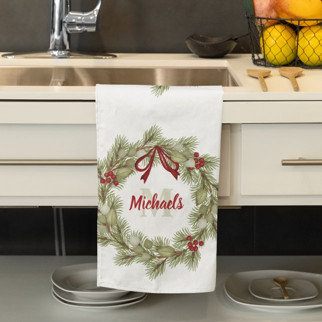 Red Green Christmas Wreath Custom Name Holiday Tea Towel (Christmas greenery wreath with red ribbon customized with monogram. )