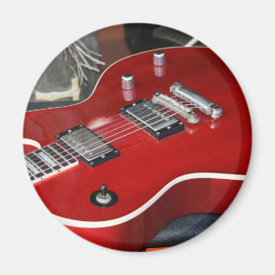 Red guitar on amp magnet