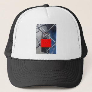 Red heart lock on fence trucker hat