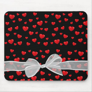 red hearts and bow on black mouse mat