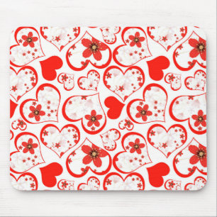 Red hearts and flowers on a white mouse mat