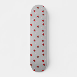 Red hearts on grey skateboard