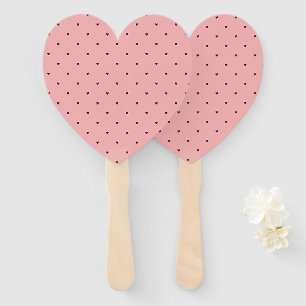Red hearts on pink hand fan