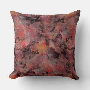 Red-hued patches on grainy black grey background cushion