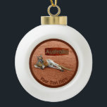 Red Kangaroo In Slouch Hat Ceramic Ball Christmas Ornament<br><div class="desc">A Red Kangaroo buck, wearing a traditional Australian slouch hat, rests on in the desert. A placard with text reading, "Australia" in a style reminiscent of Aboriginal bark painting, also appears. Add your own additional text. The Red Kangaroo (Macropus rufus) is the largest kangaroo species and Australia's largest terrestrial animal....</div>