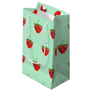 Red kawaii strawberry fruit on blue small gift bag