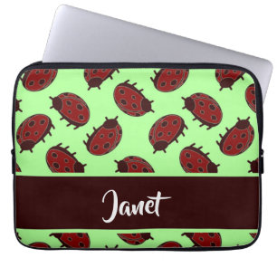 Red ladybugs on green laptop sleeve