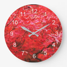 Red leaves all around  large clock