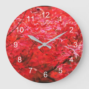 Red leaves all around large clock