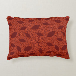 Red leaves pattern on orange decorative cushion
