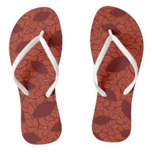 Red leaves pattern on orange flip flops