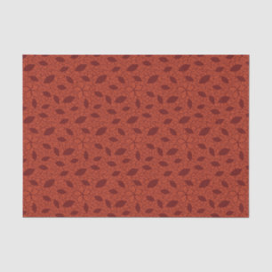 Red leaves pattern on orange tissue paper