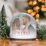 Red Lettering Married & Merry Wedding Photo Snowglobe<br><div class="desc">Add a festive pop of colour to your holiday décor with this personalised Married & Merry snow globe by Redwood & Vine Design Co. Designed with bold red lettering and elegant script, it highlights your favourite wedding photo along with customisable names. A perfect keepsake for your first Christmas as newlyweds...</div>