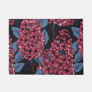 Red lilac on dark blue doormat