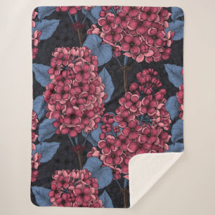 Red lilac on dark blue sherpa blanket