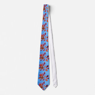 Red maple leaves against blue sky tie