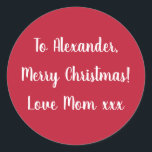 Red Merry Christmas from Mum gift tag sticker<br><div class="desc">Red Christmas gift tag sticker with the message Merry Christmas Love Mum xxx in white typography/ script. Simply change the name Alexander to your loved one in the personalise text box. Want to make more changes? All of the text can be personalised. Or if you want to change the colour,...</div>