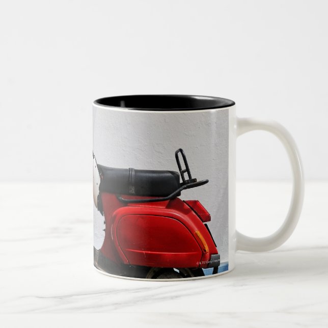 Red motor scooter by wall, Stromboli Island, Two-Tone Coffee Mug (Right)