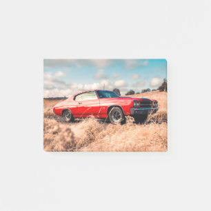 Red Muscle Car in grass. Post-it Notes