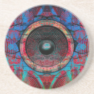 Red music speakers on a cracked wall coaster