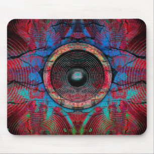 Red music speakers on a cracked wall mouse mat