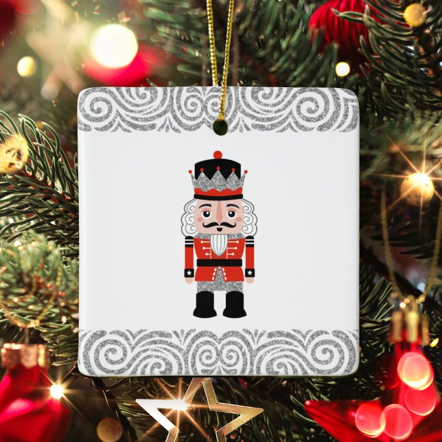 Red Nutcracker Christmas Holiday  Ceramic Ornament (An elegant red and silver nutcracker Christmas Ornament. Put a family photo on the back.)