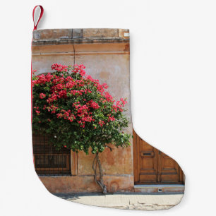 RED PETAL FLOWER ON CONCRETE WALL SMALL CHRISTMAS STOCKING