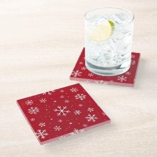 Red pillow with white snowflake pattern glass coaster