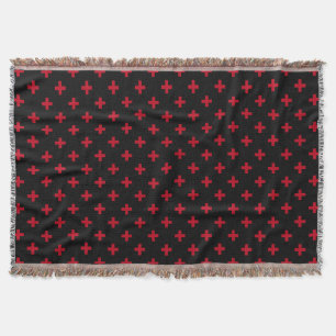 Red polka crosses on black throw blanket