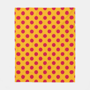 Red polka dots on yellow fleece blanket