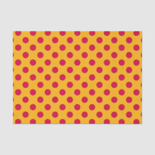 Red polka dots on yellow tissue paper