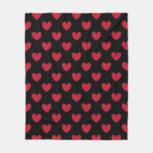 Red polka hearts on black fleece blanket