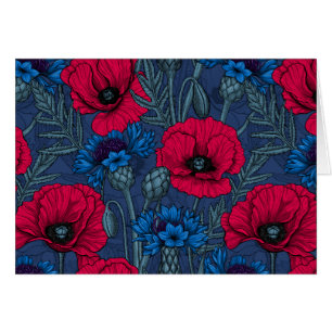 Red poppies and blue cornflowers on blue