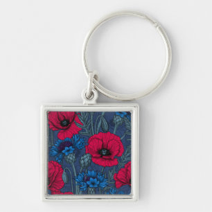 Red poppies and blue cornflowers on blue key ring
