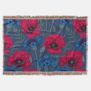 Red poppies and blue cornflowers on blue throw blanket