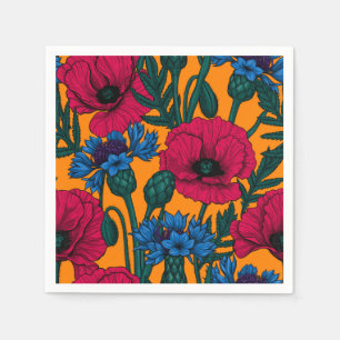 Red poppies and blue cornflowers on orange napkin