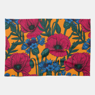 Red poppies and blue cornflowers on orange tea towel